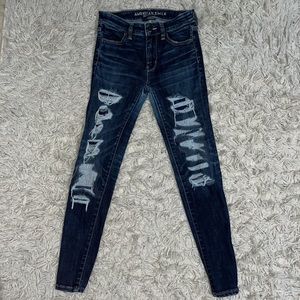 American Eagle skinny ripped blue/navy jeans (never used) size 0.